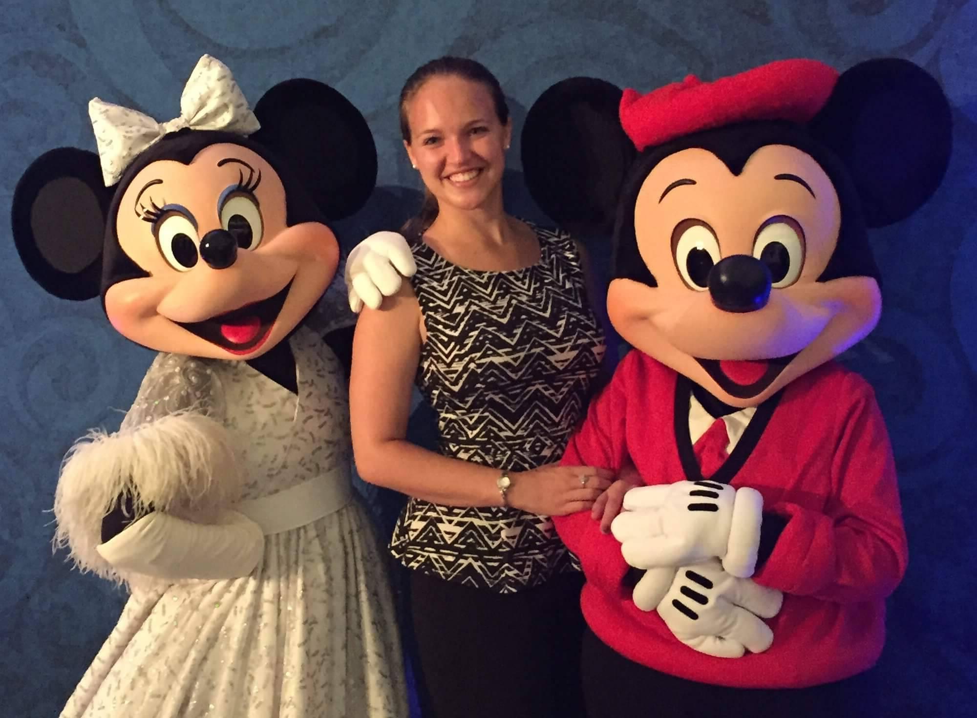 Elizabeth Stolz posing with Mickey and Minnie mouse